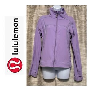 Zip up jacket with thumb holes and pockets